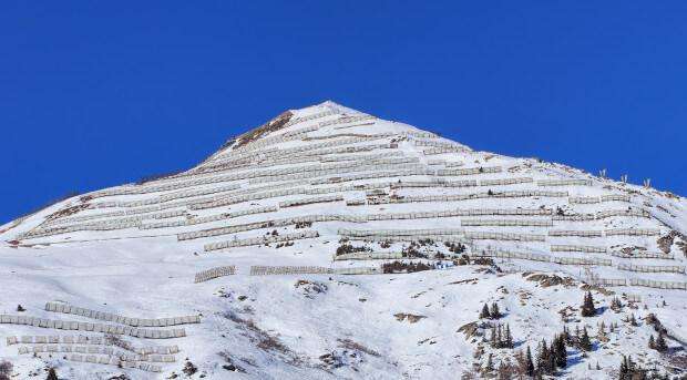 Steel fences hold the weight of snow and prevent avalanches